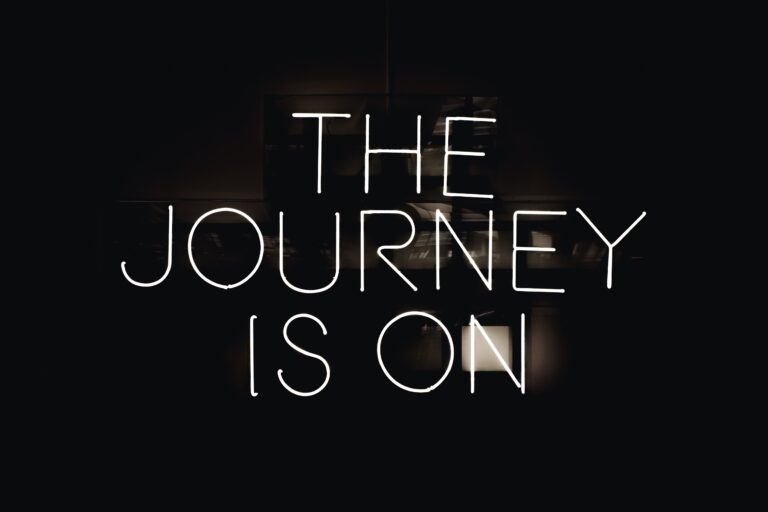 Neon lights with text the journey is on